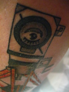 Man w/ a Movie Camera Tattoo